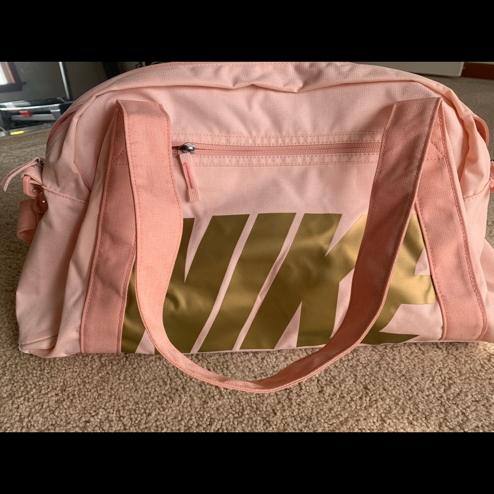 Soft pink and gold Nike duffel bag- hardly used!